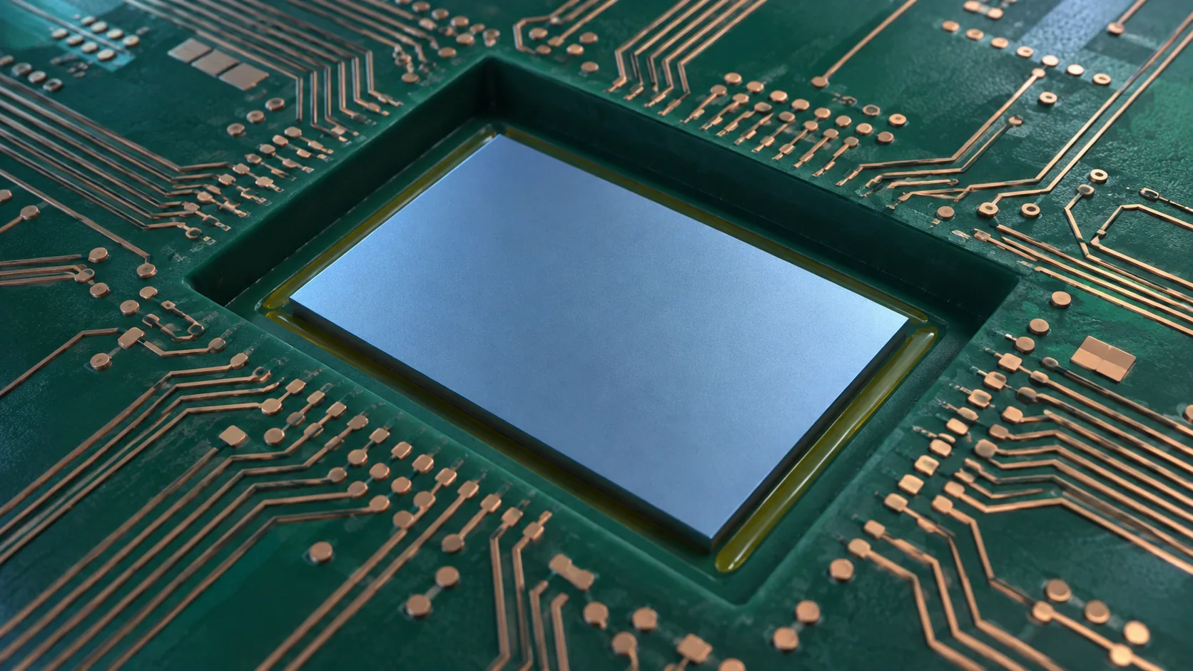 Close-up conceptual image of a small rectangular piece of silicon resting in a shallow cavity cut into a package substrate