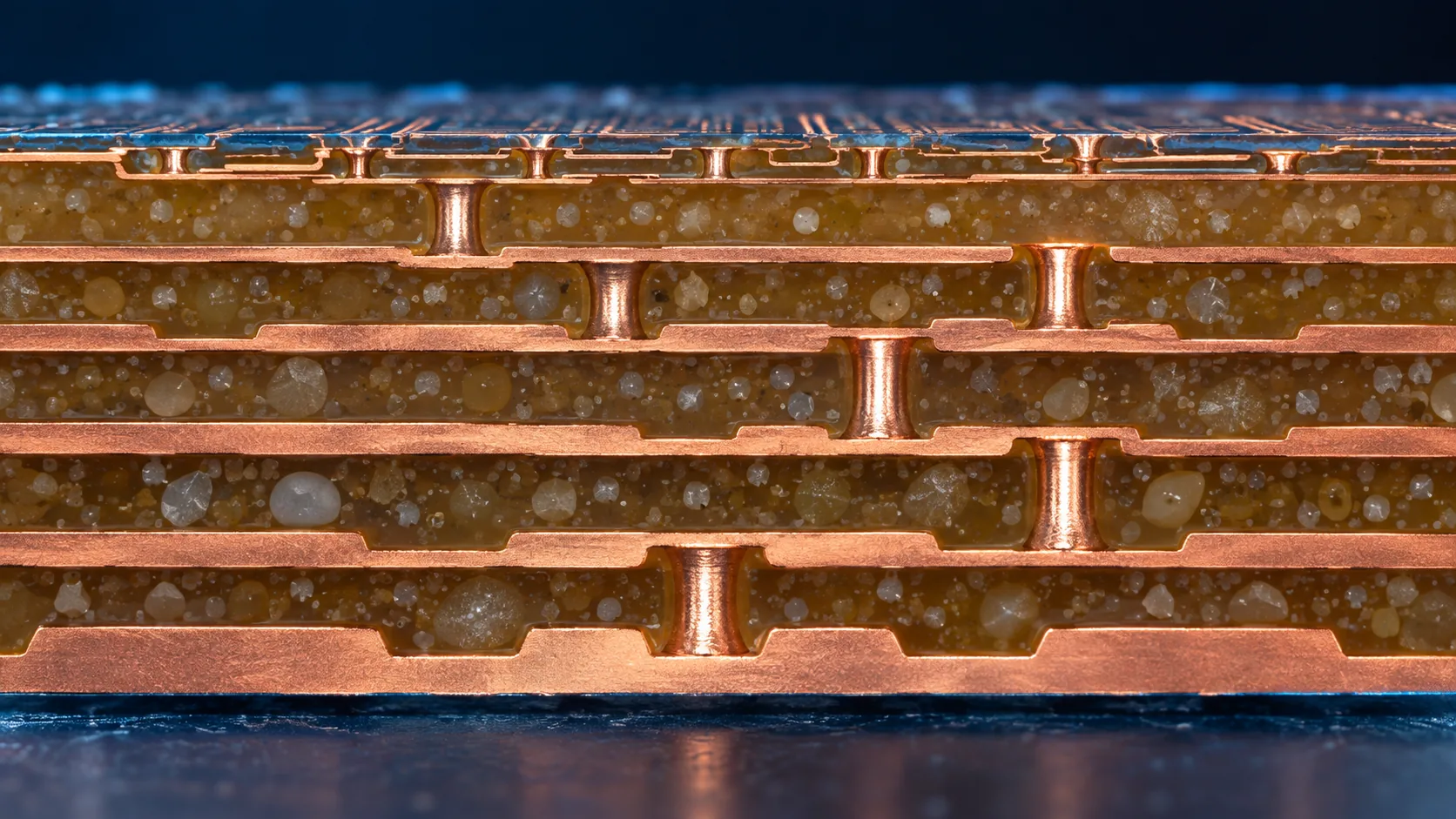 Macro image of a build-up substrate in which resin dielectric layers and copper wiring layers alternate, joined between layers by laser-drilled and plated vias