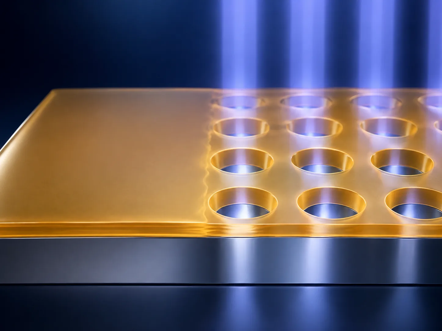Conceptual image of light striking a polymer film and tiny openings forming as it is developed