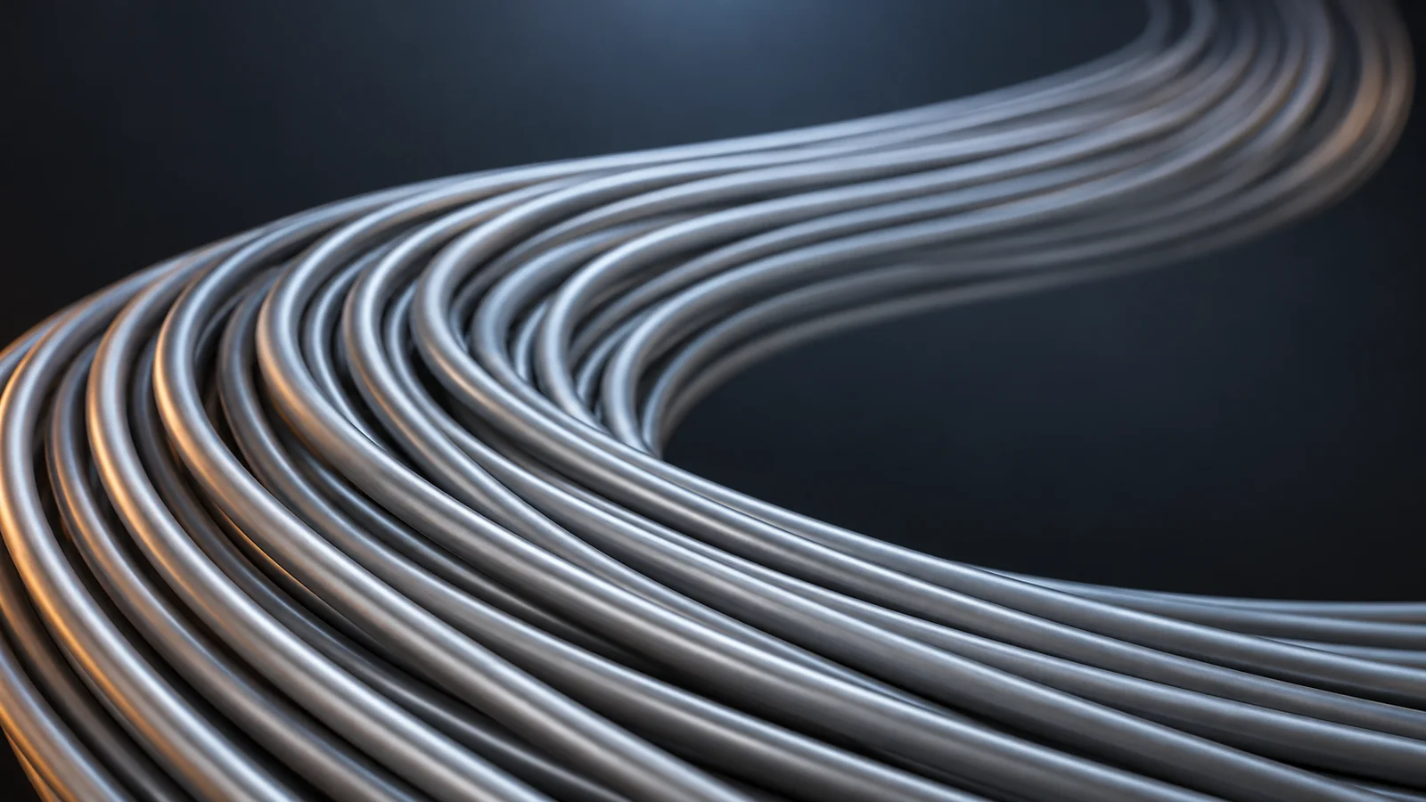 Conceptual image of many thin silver-jacketed cables bundled in parallel against a dark background, curving gently as they run into the distance