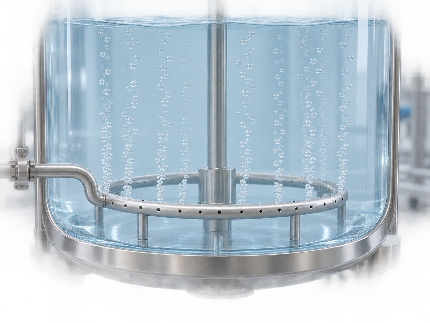 3D conceptual view of gas entering a ring sparger near the bottom of a transparent bioreactor and rising as small bubbles through pale blue culture medium